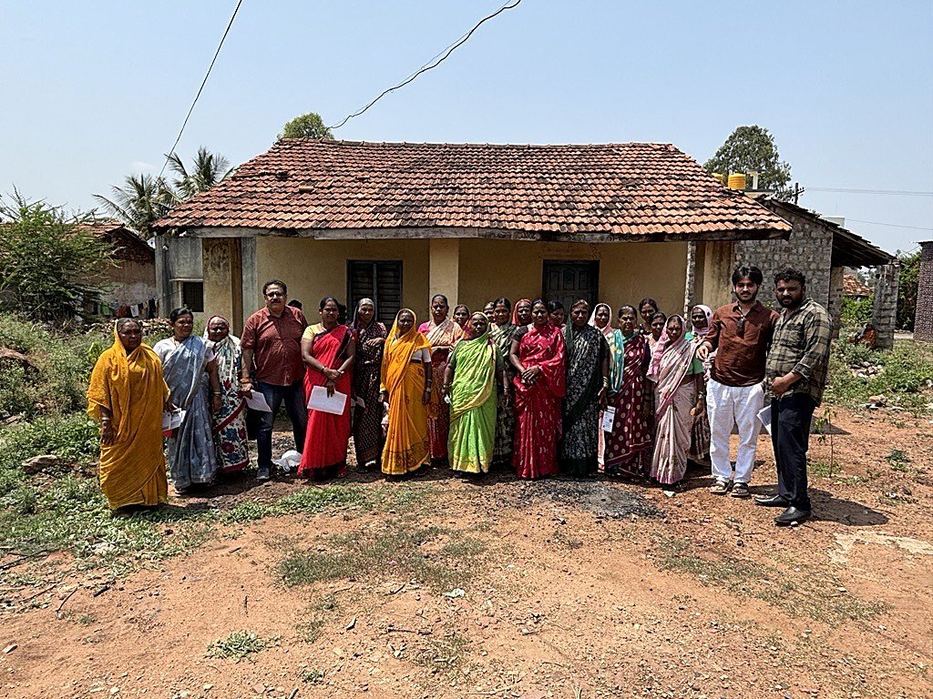 A self-help group with the team outside the village centre